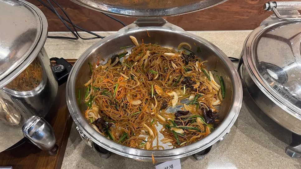 Neatly arranged namul side dishes on the self-serve bar