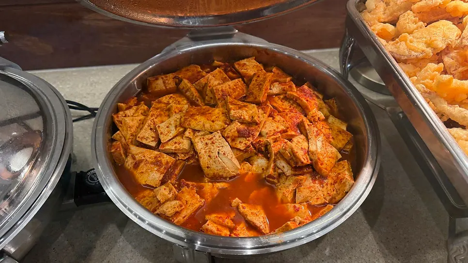 The fried snacks and japchae corner on the self-serve bar