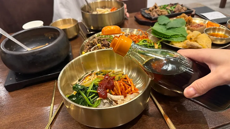 A plate of japchae and other side dishes