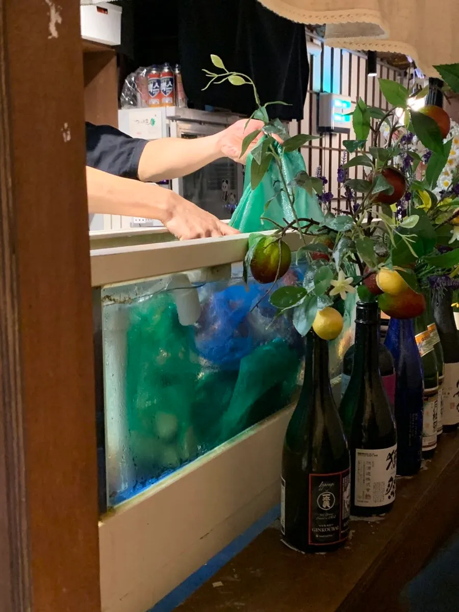 Sashimi being prepared as seen from the dachi seats