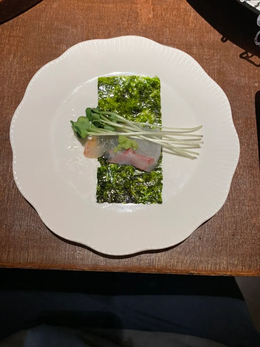 Seaweed and radish sprouts served with the sashimi