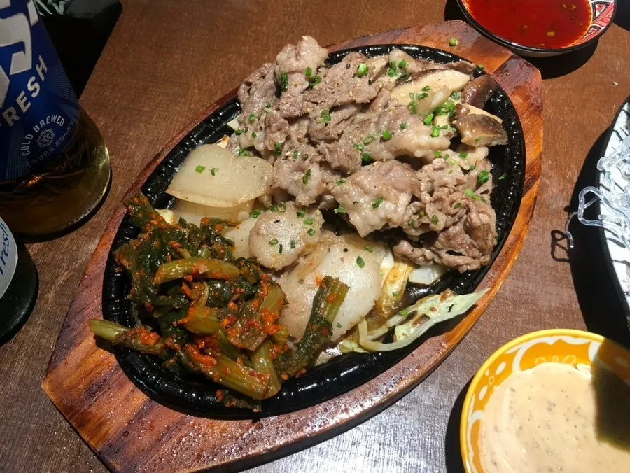 Full spread of butter-grilled surf clam and beef brisket samhap from Jangheung