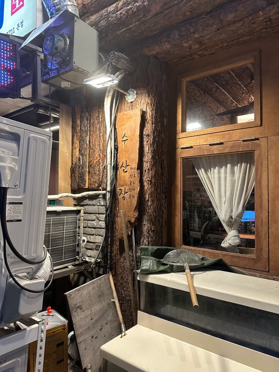 Exterior of Susan Jang Suwon Yeongtong Branch decorated with log timber and wooden doors