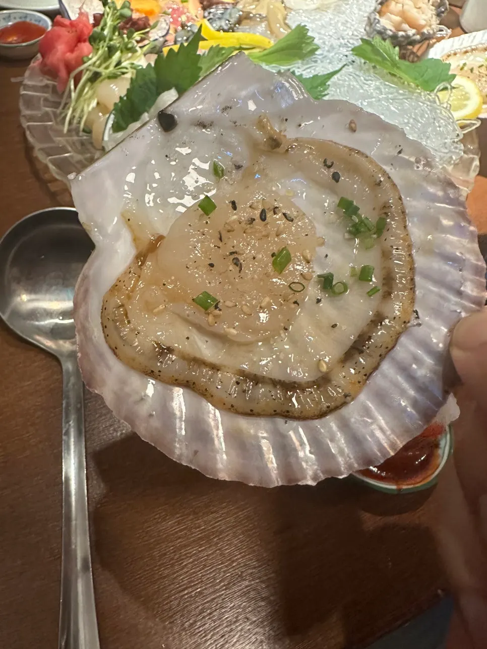 Large scallop served in its shell