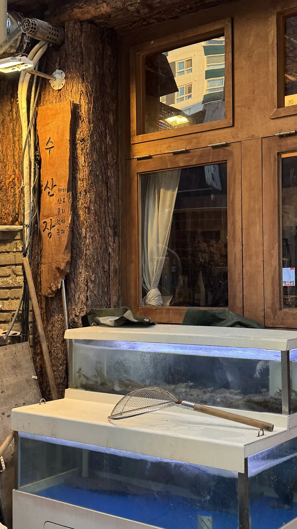 Shrimp tank in front of the restaurant entrance