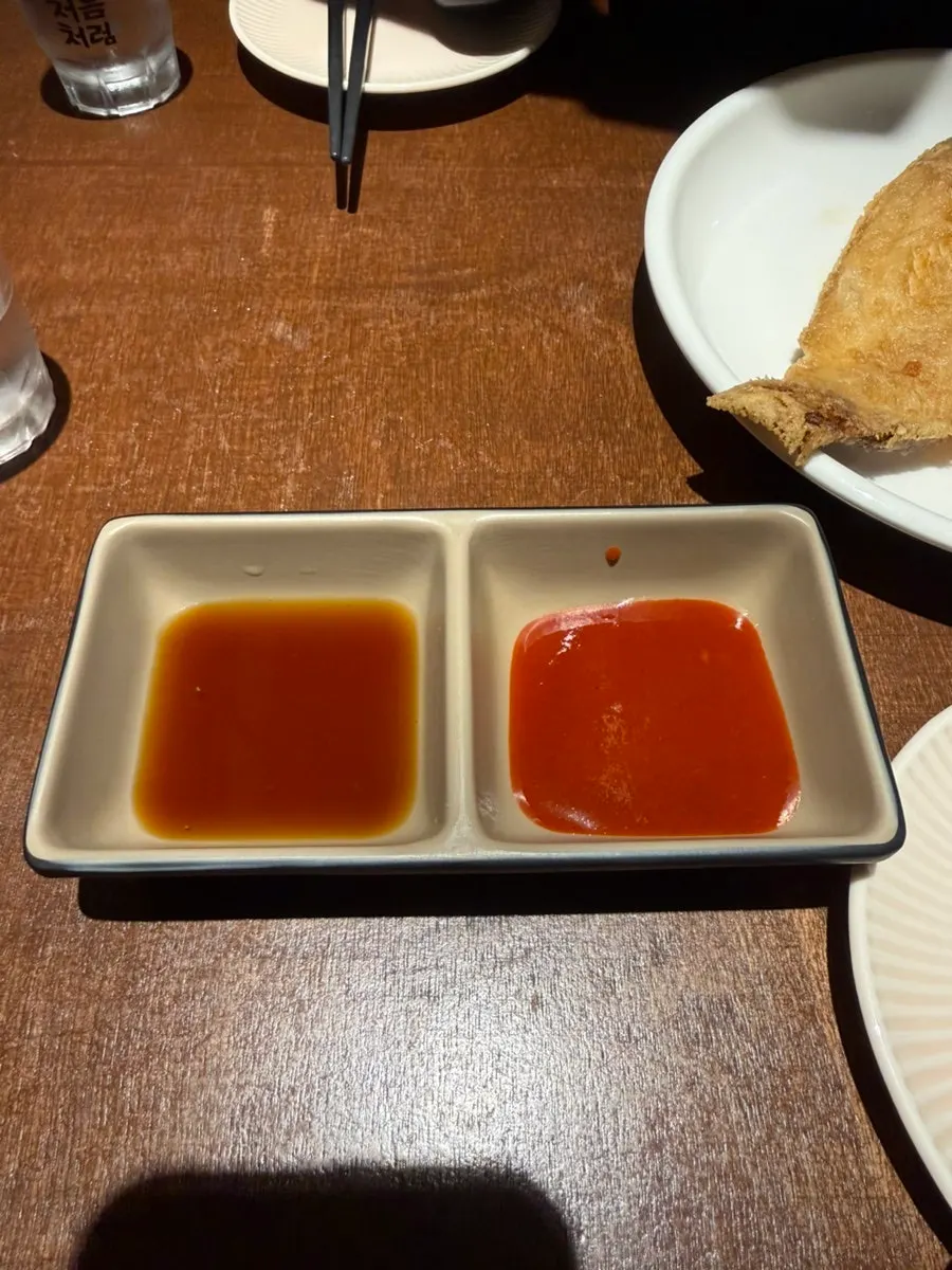 Drink glasses placed alongside the sauce dishes