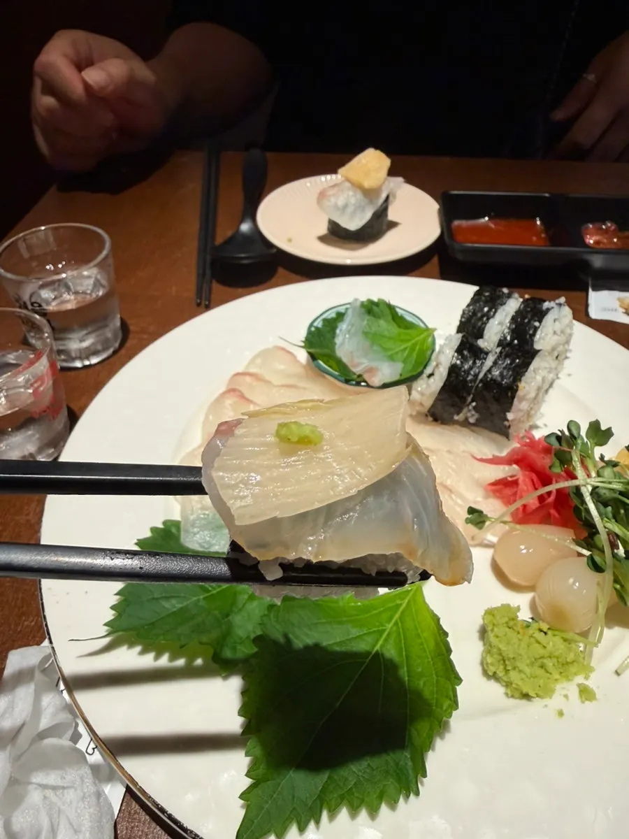 Flounder sashimi and aged kimchi on top of salt gimbap