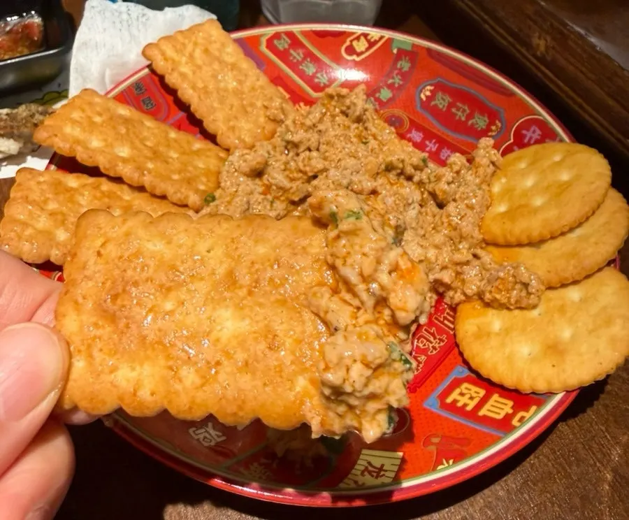 Ankimo placed on top of a cracker