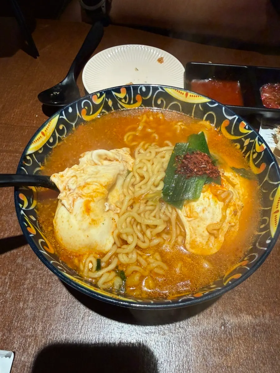 Spicy gyeduman broth and noodles