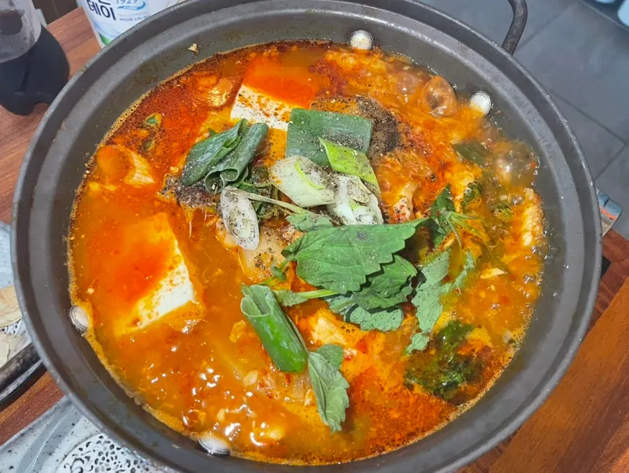 Spicy complimentary fish stew with tofu and fish