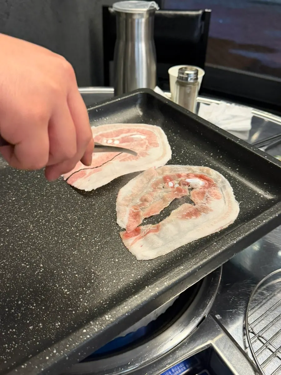 Thin naengsam spread out on the grill
