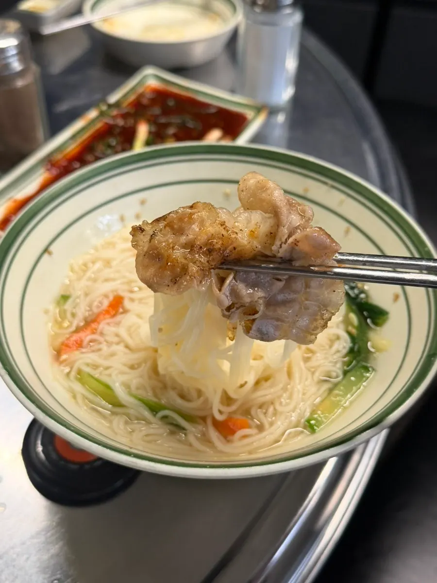 A bowl filled generously with hot jachi guksu