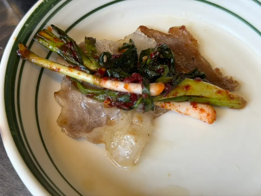 A piece of naengsam wrapped in perilla leaf