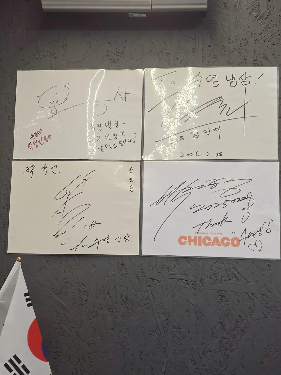 Celebrity autographs hanging at Suyeong Naengsam entrance