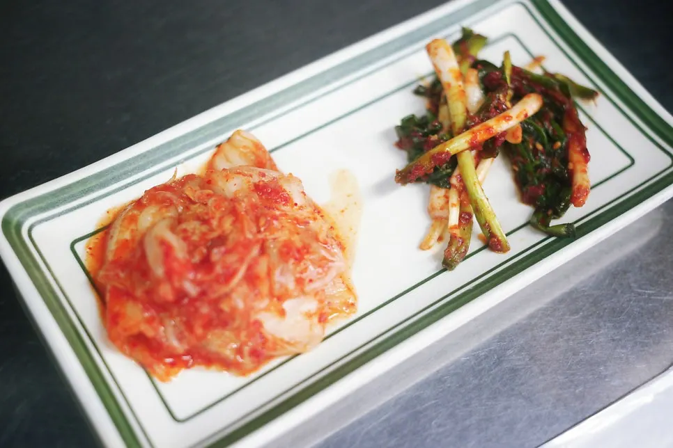 Basic table setting with sauces and kimchi at Suyeong Naengsam
