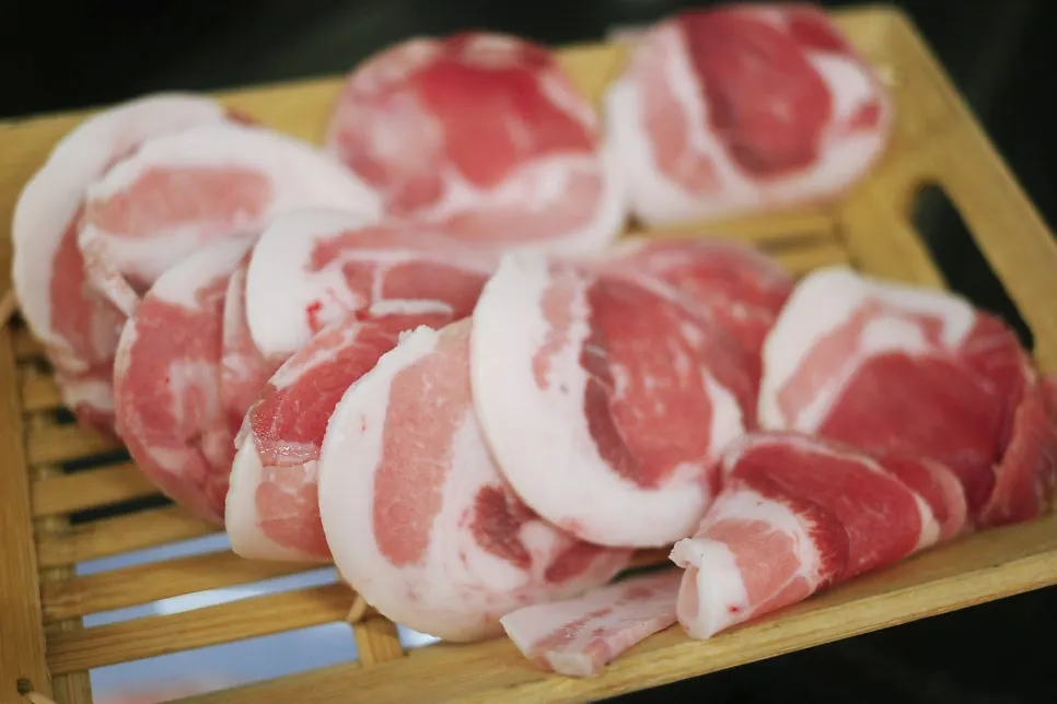 Table with frozen pork belly and pork jowl served together
