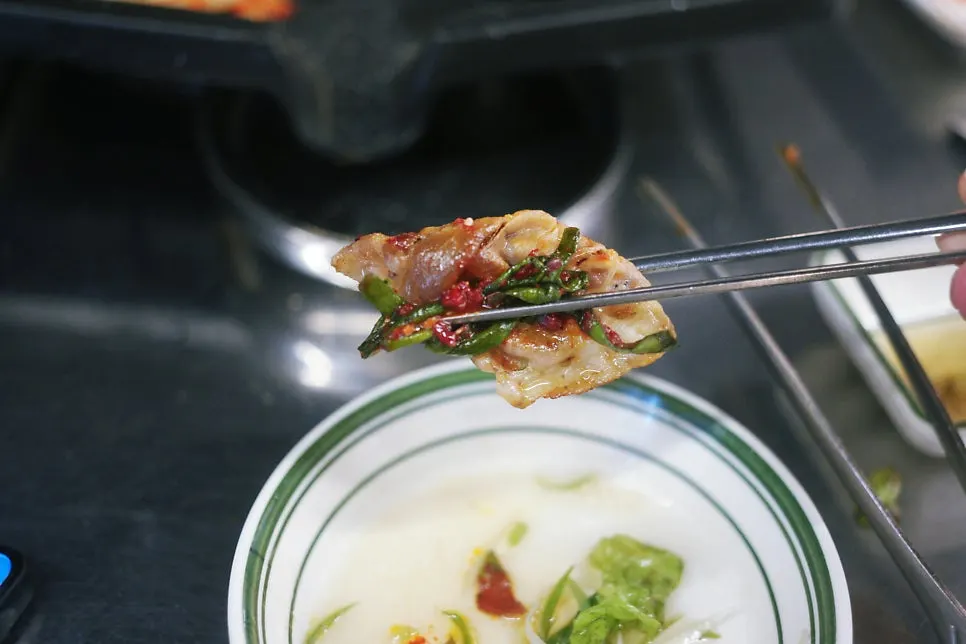 Frozen pork belly served with homemade green onion kimchi