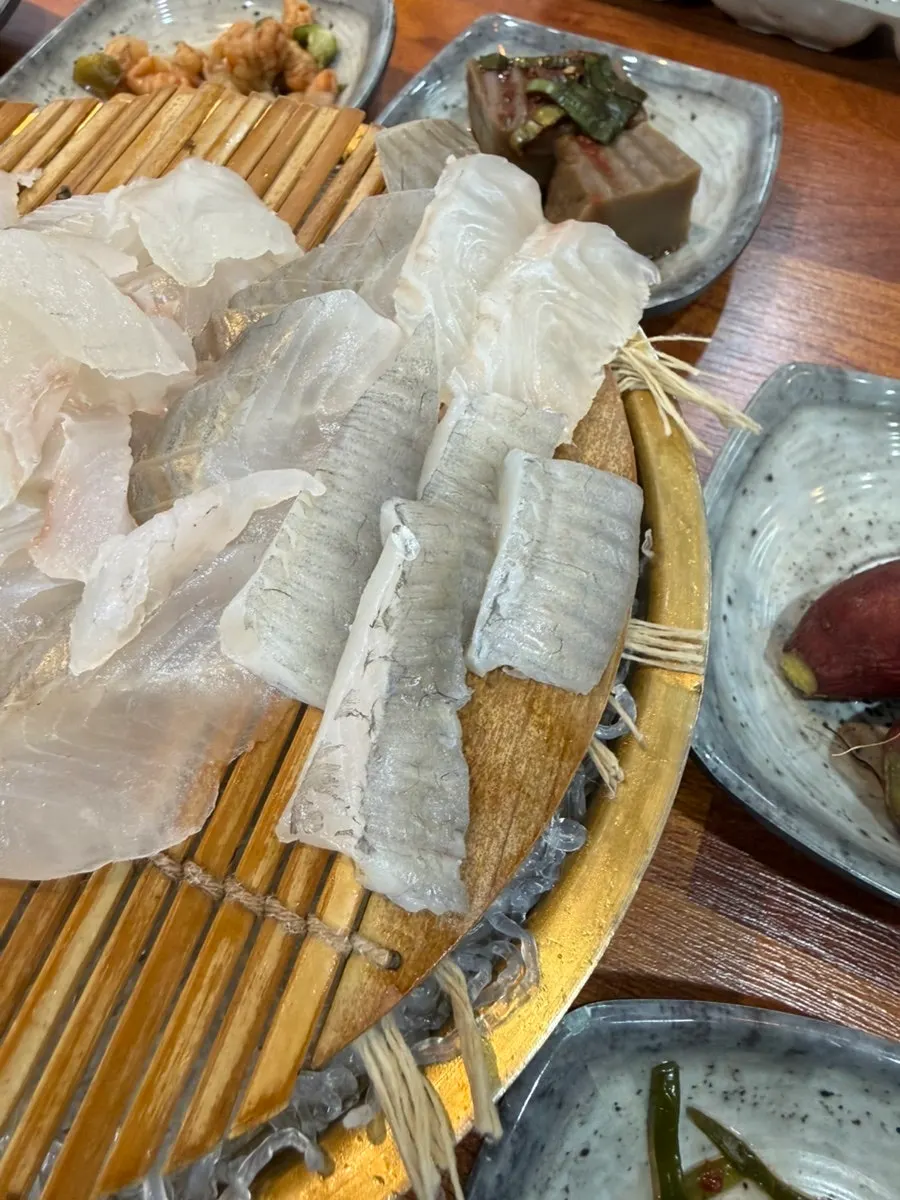 Generous portion of flounder fin in the assorted sashimi