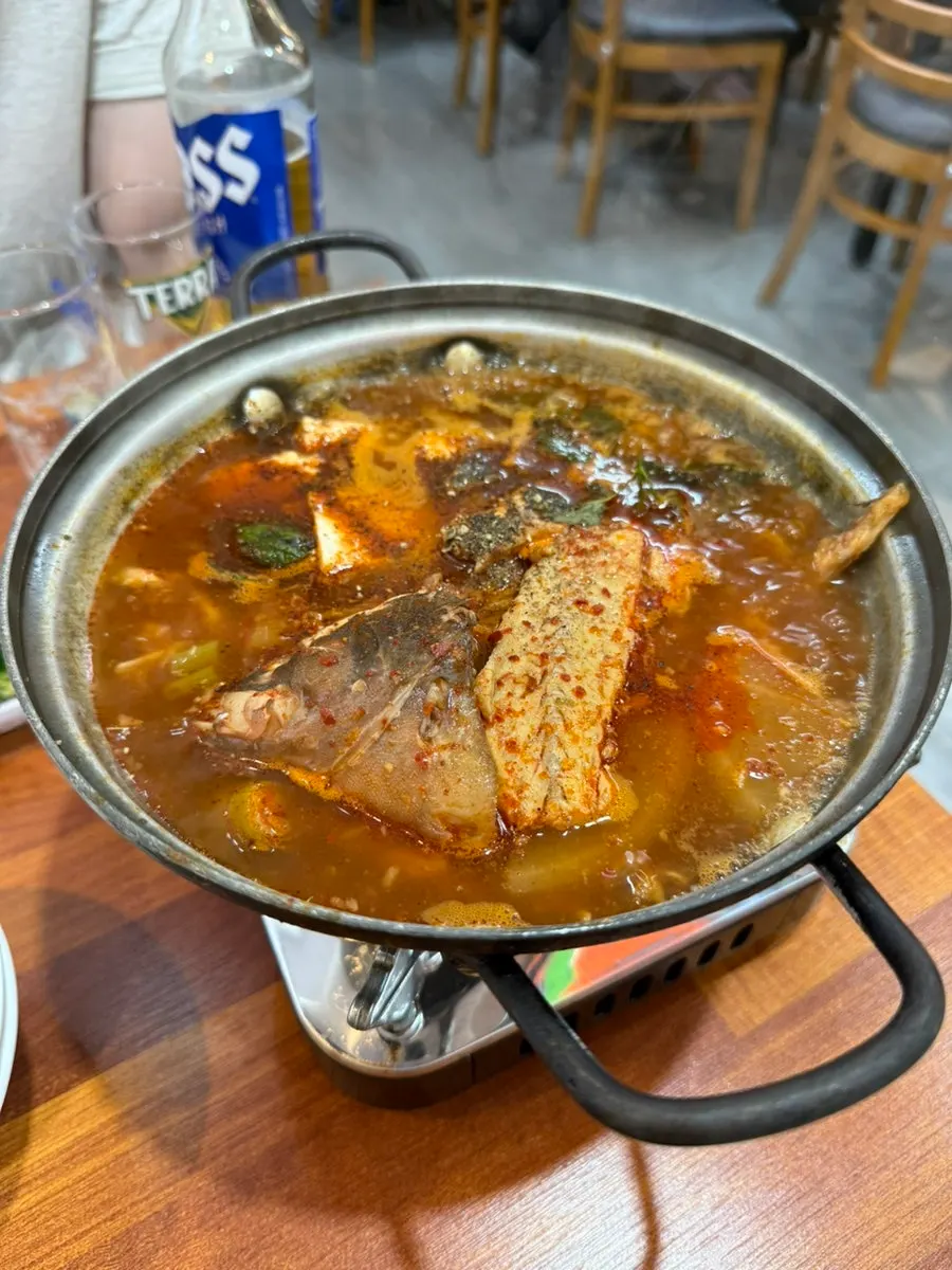 Free spicy fish stew bubbling on the burner