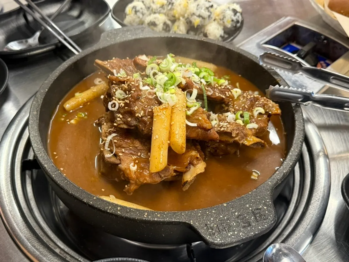Soy-sauce bone grill topped with scallions and sesame seeds