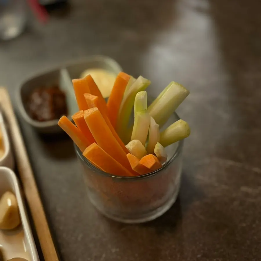A plate of carrots and cucumber as complimentary side dishes