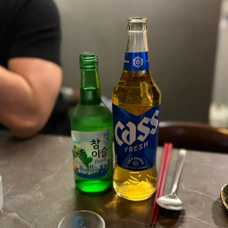 A table with both soju and beer ordered
