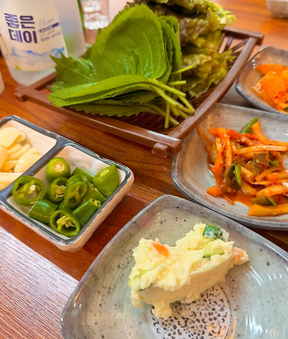 A full spread of banchan set on the table