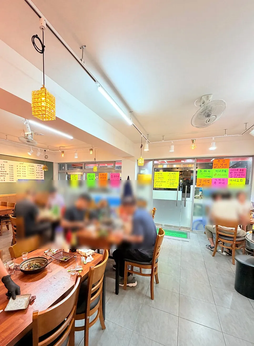 The dining hall filled with neighborhood guests in the evening