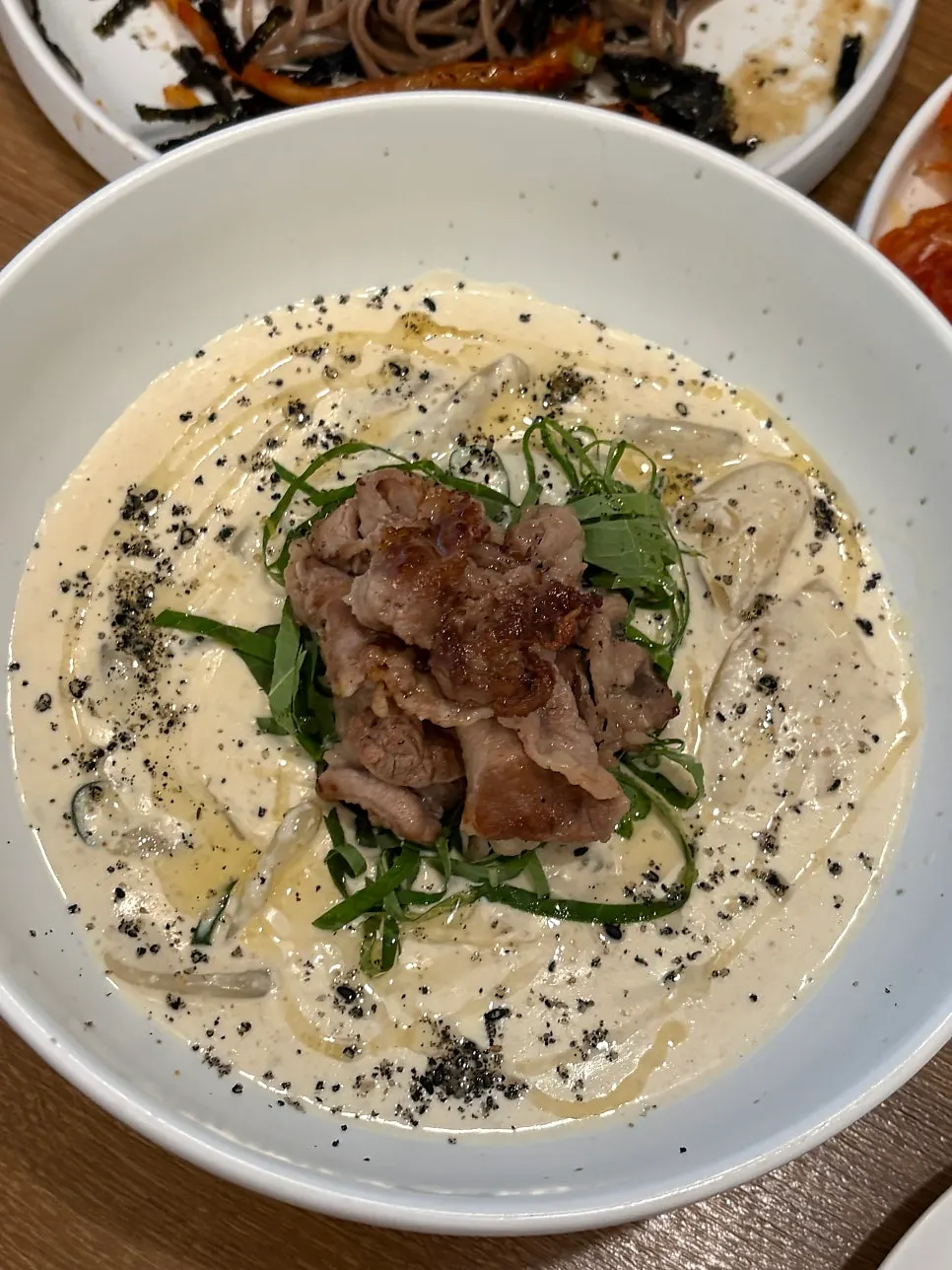 Close-up of beef brisket on top of the perilla cream