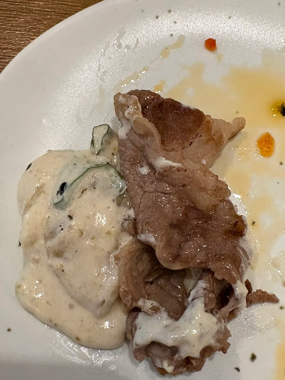 A spoonful of perilla cream potato sujebi with beef brisket