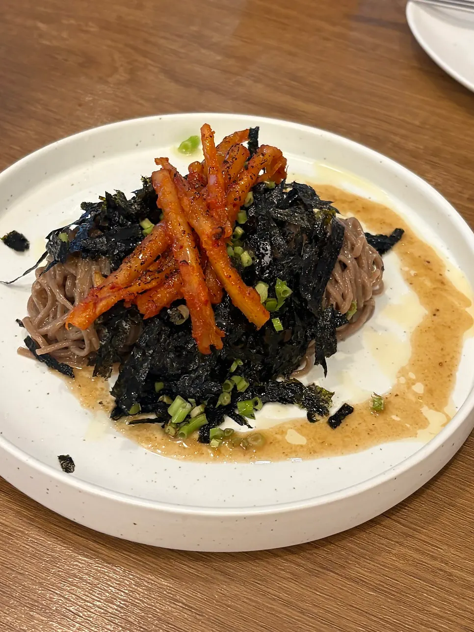 A bowl of Susu Yeonnam's deodeok-grilled perilla oil makguksu