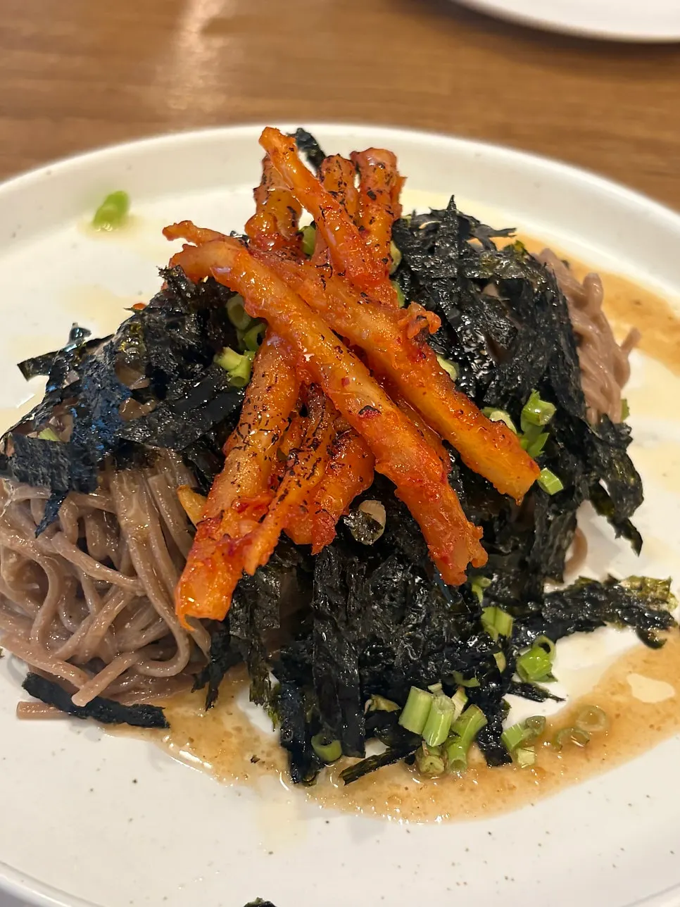 Close-up of the perilla oil noodles and grilled deodeok
