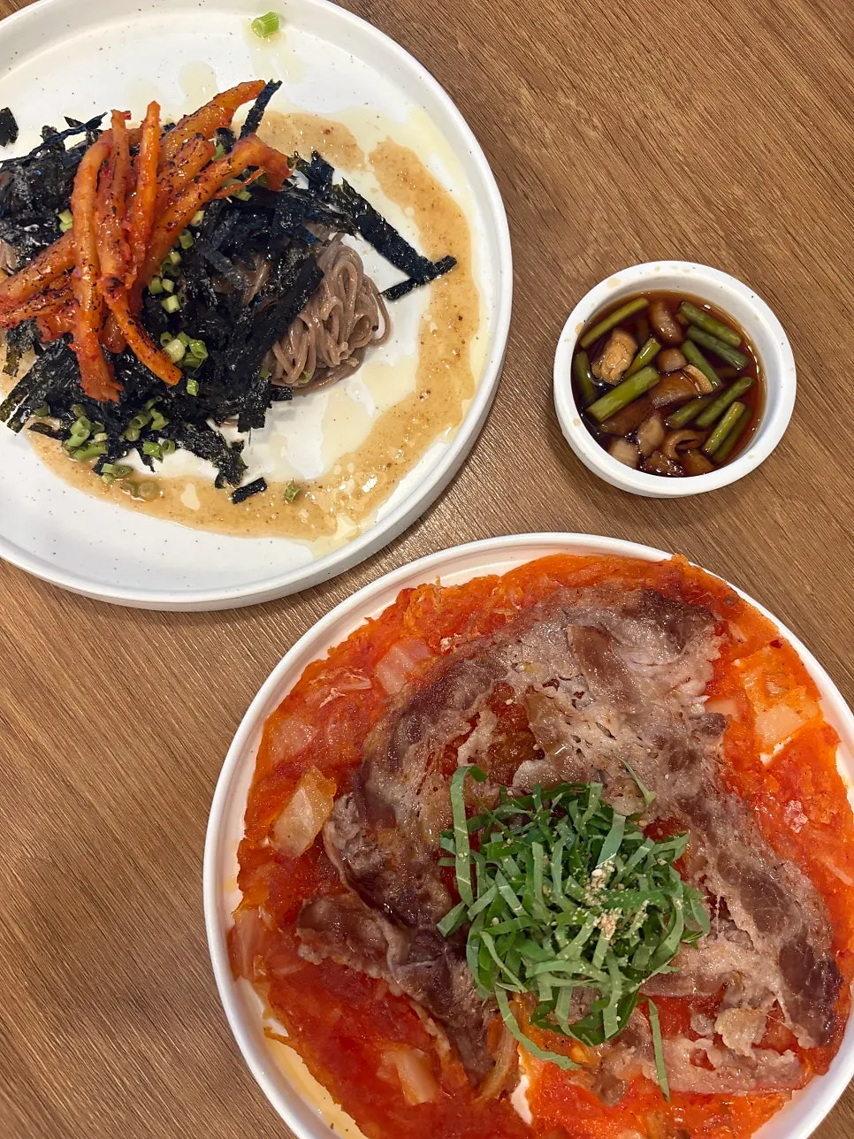 A cut piece of beef brisket kimchi jeon shared among friends