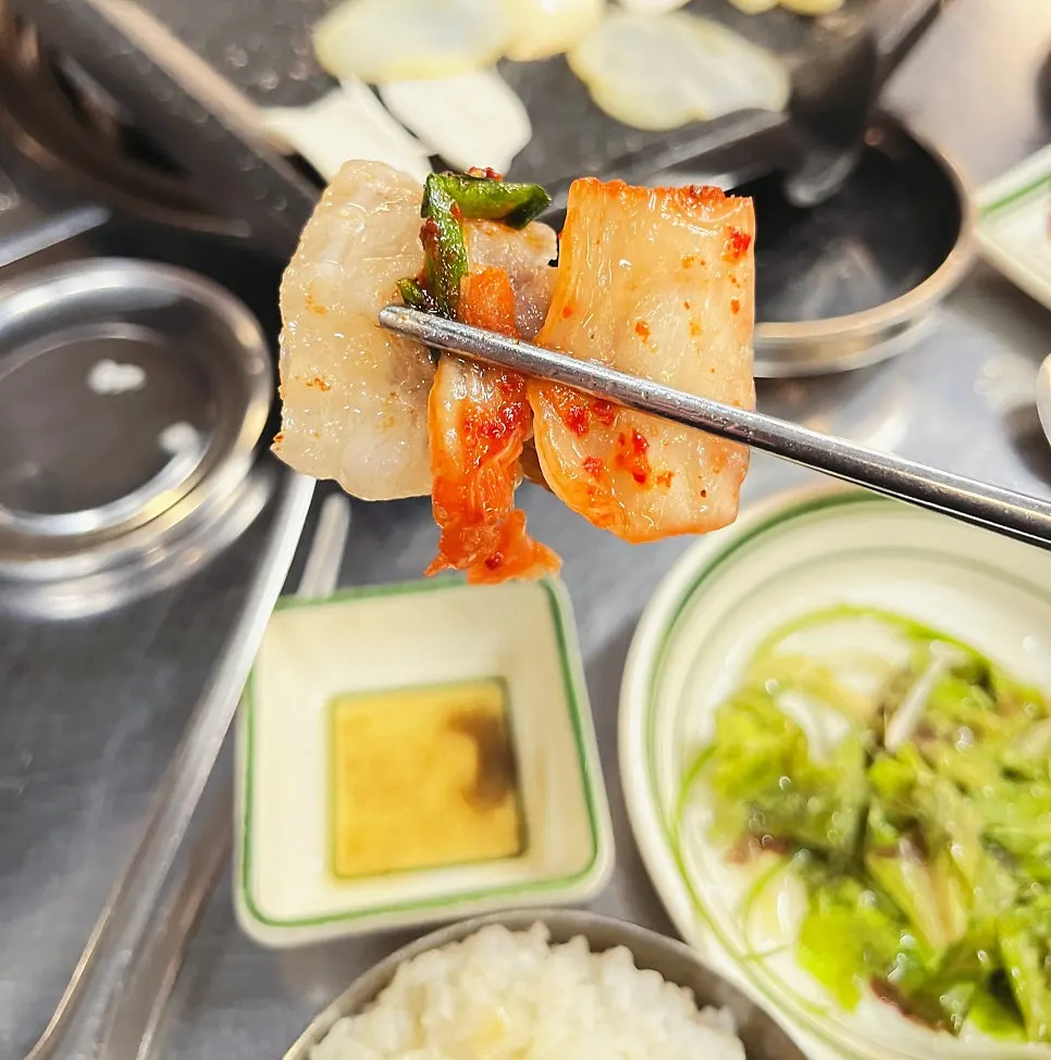 Aged kimchi grilling at the bottom of the plate