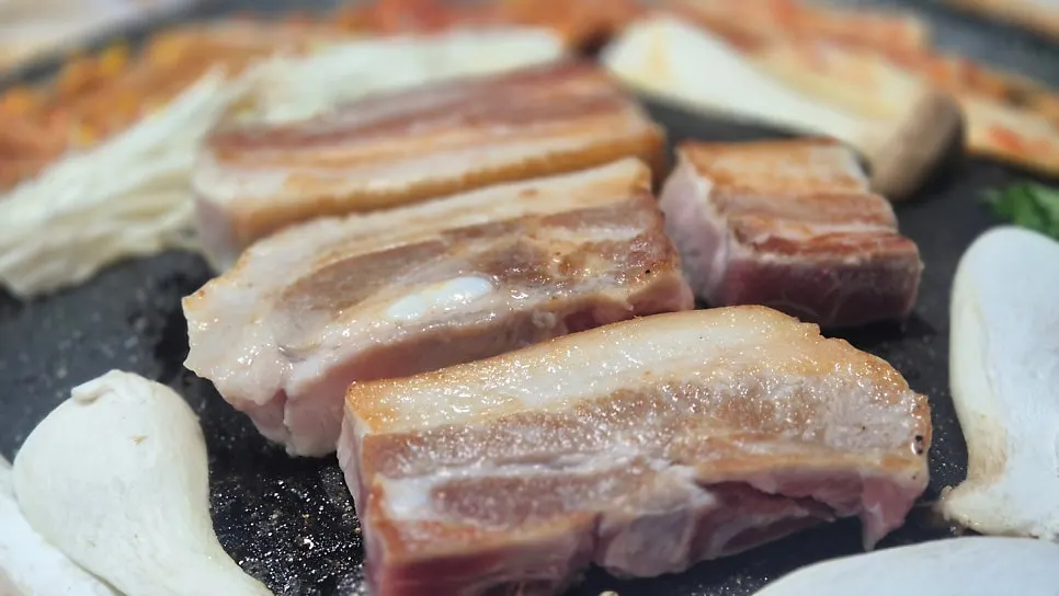 Heading to a Suyu pork belly restaurant craving cauldron-lid whole pork belly