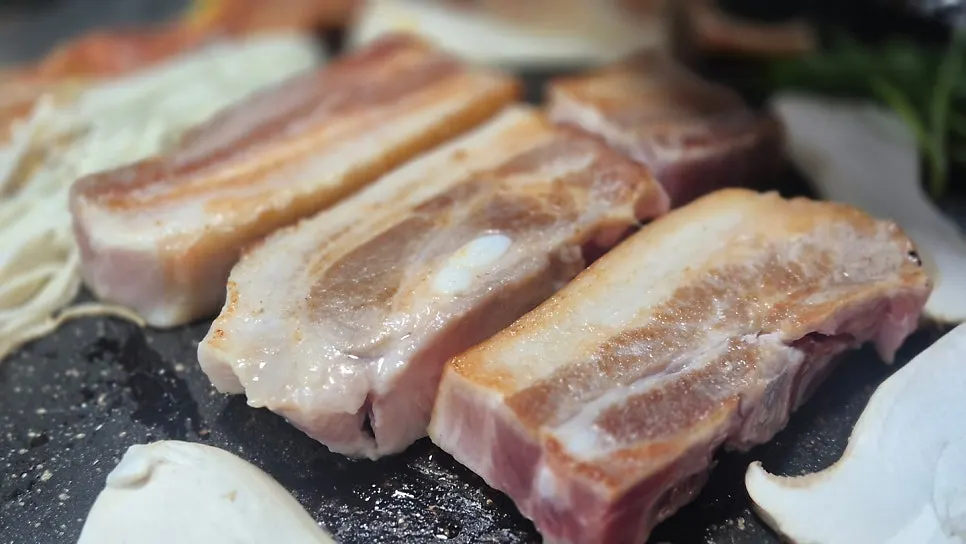 View of a cauldron-lid pork belly restaurant near Suyu Station