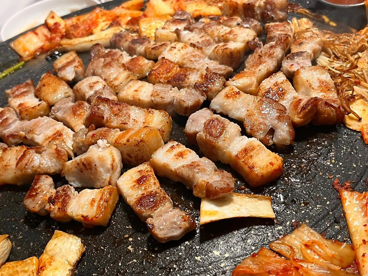 Crispy grilled bean sprouts and a piece of pork belly