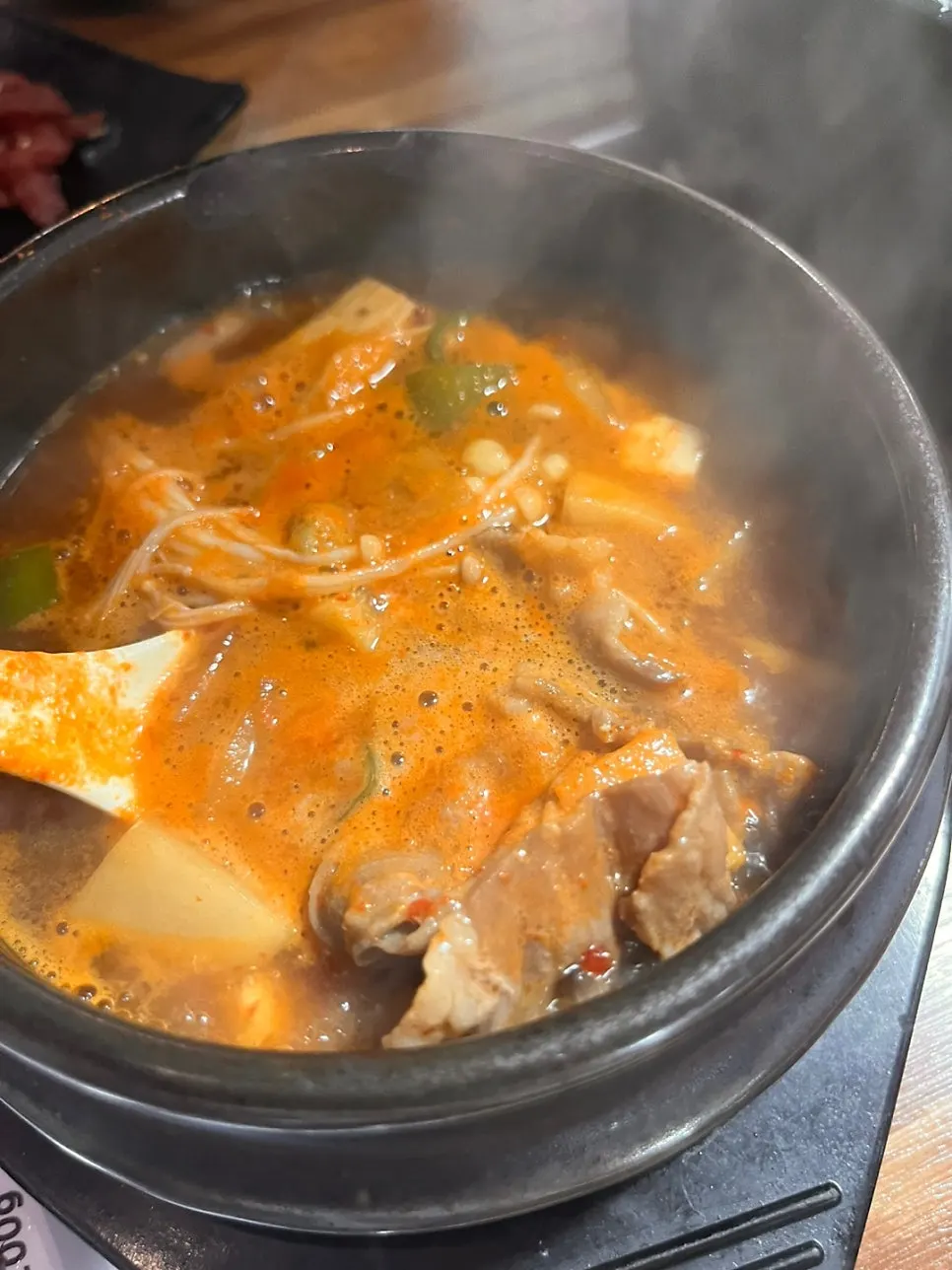 Brisket doenjang jjigae served bubbling in a stone pot