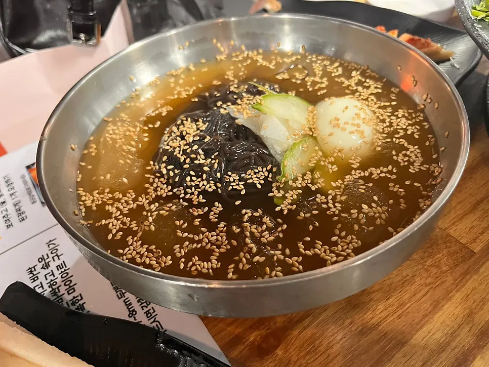 Cold noodles with slush ice topped generously with sesame