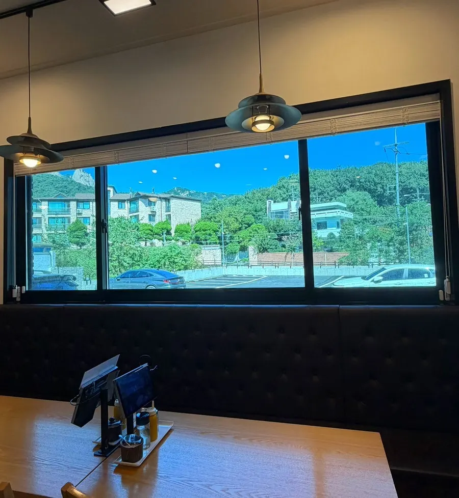 View of Bukhansan's trees seen through Iseol Myeonok's window