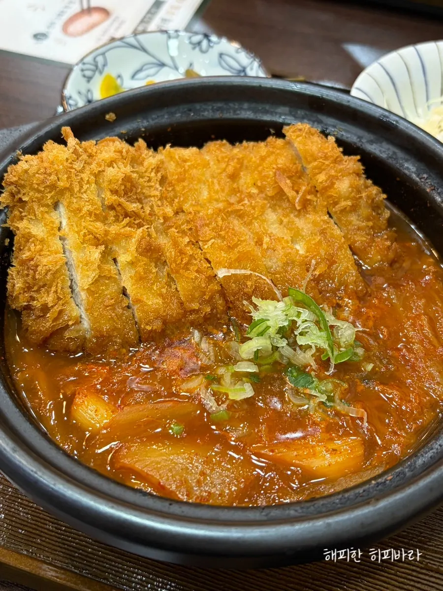 Pot of kimchi katsu nabe filled with katsu pieces