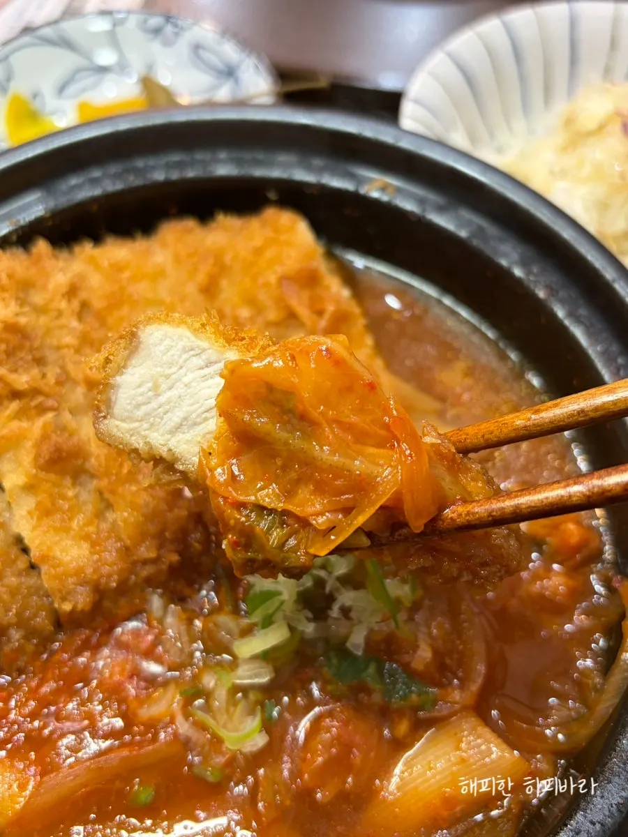 A piece of katsu soaked in the nabe broth
