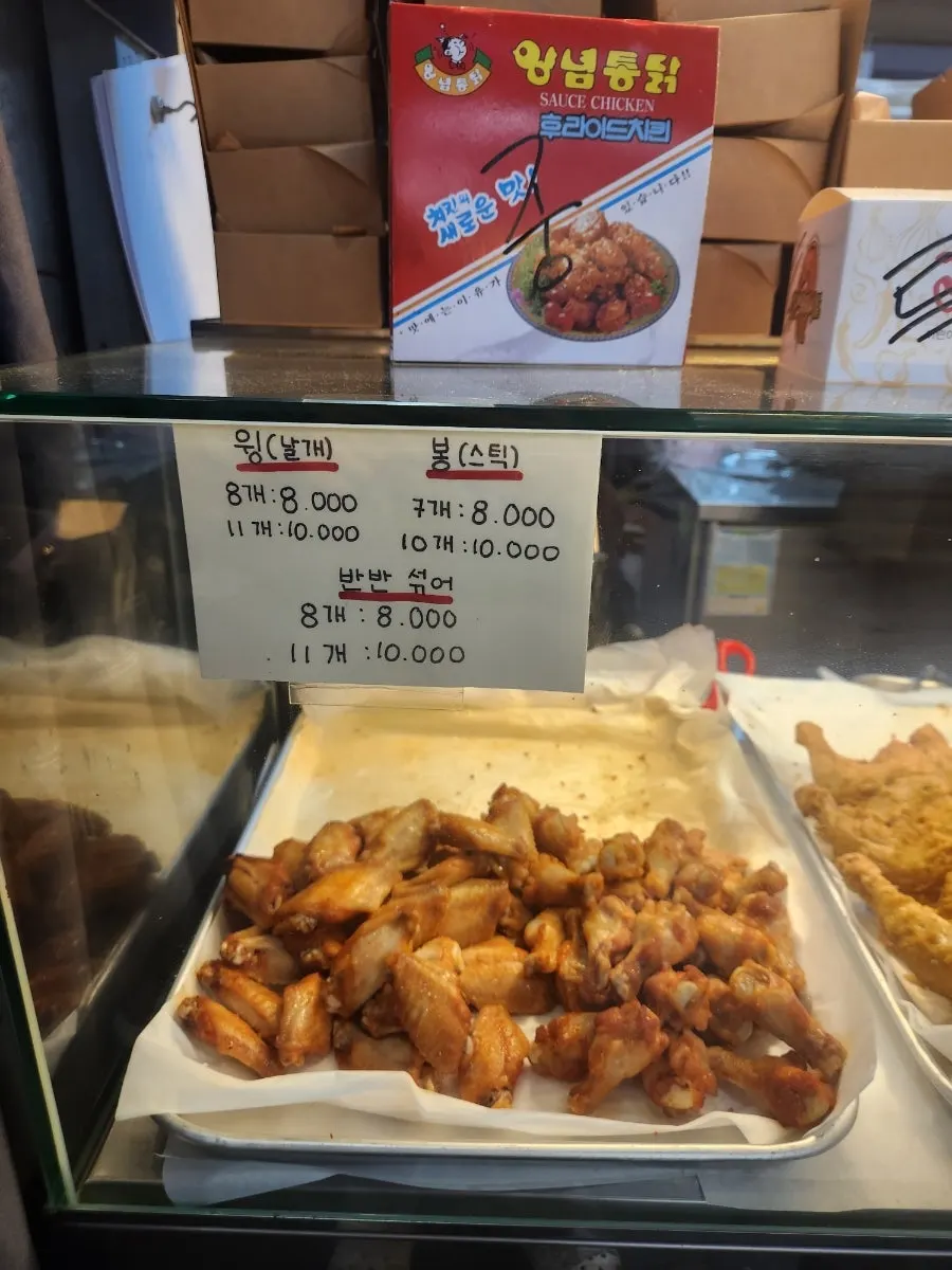 Fried whole chickens on display inside the shop