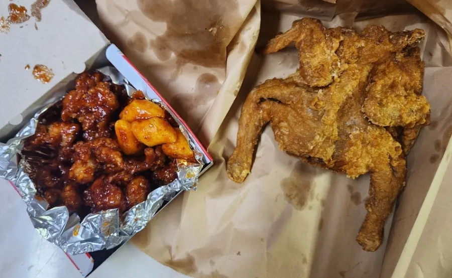 Old-style whole fried chicken and dakgangjeong laid out together