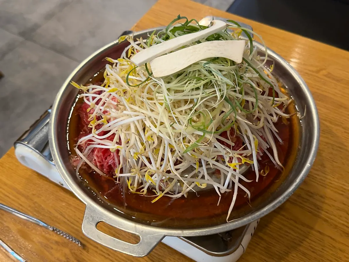 Full spread of Seoul-style old-fashioned bulgogi and bibim naengmyeon