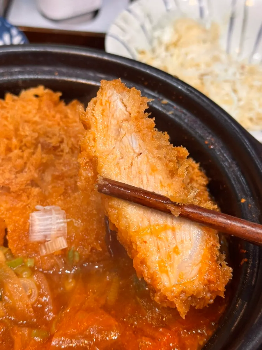 Kimchi katsu nabe pot with kimchi, egg, and tonkatsu