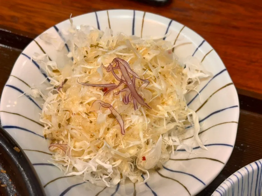 Cabbage salad and pickled radish side dishes