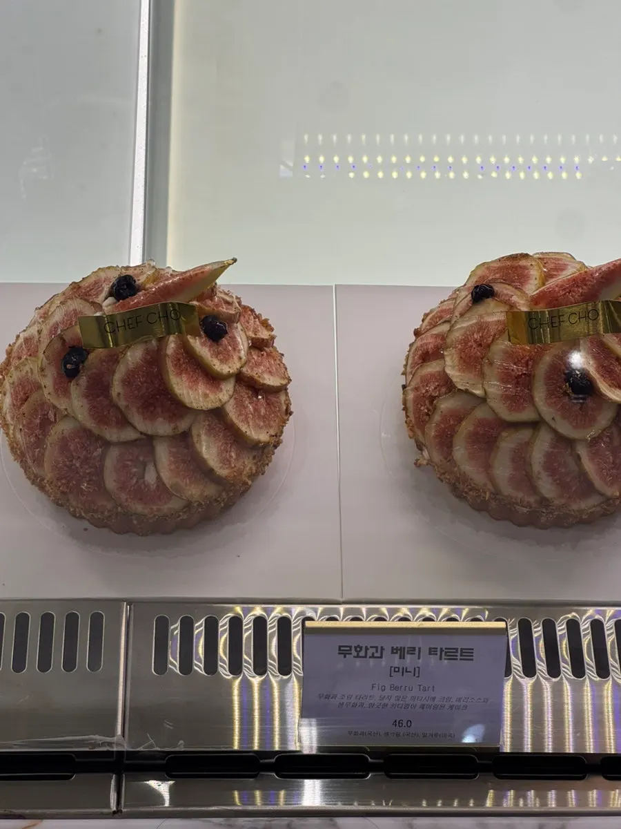 Chef Cho cakes on display piled generously with fruit