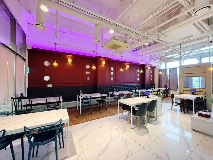 Interior blending white and wood tones with pendant lighting