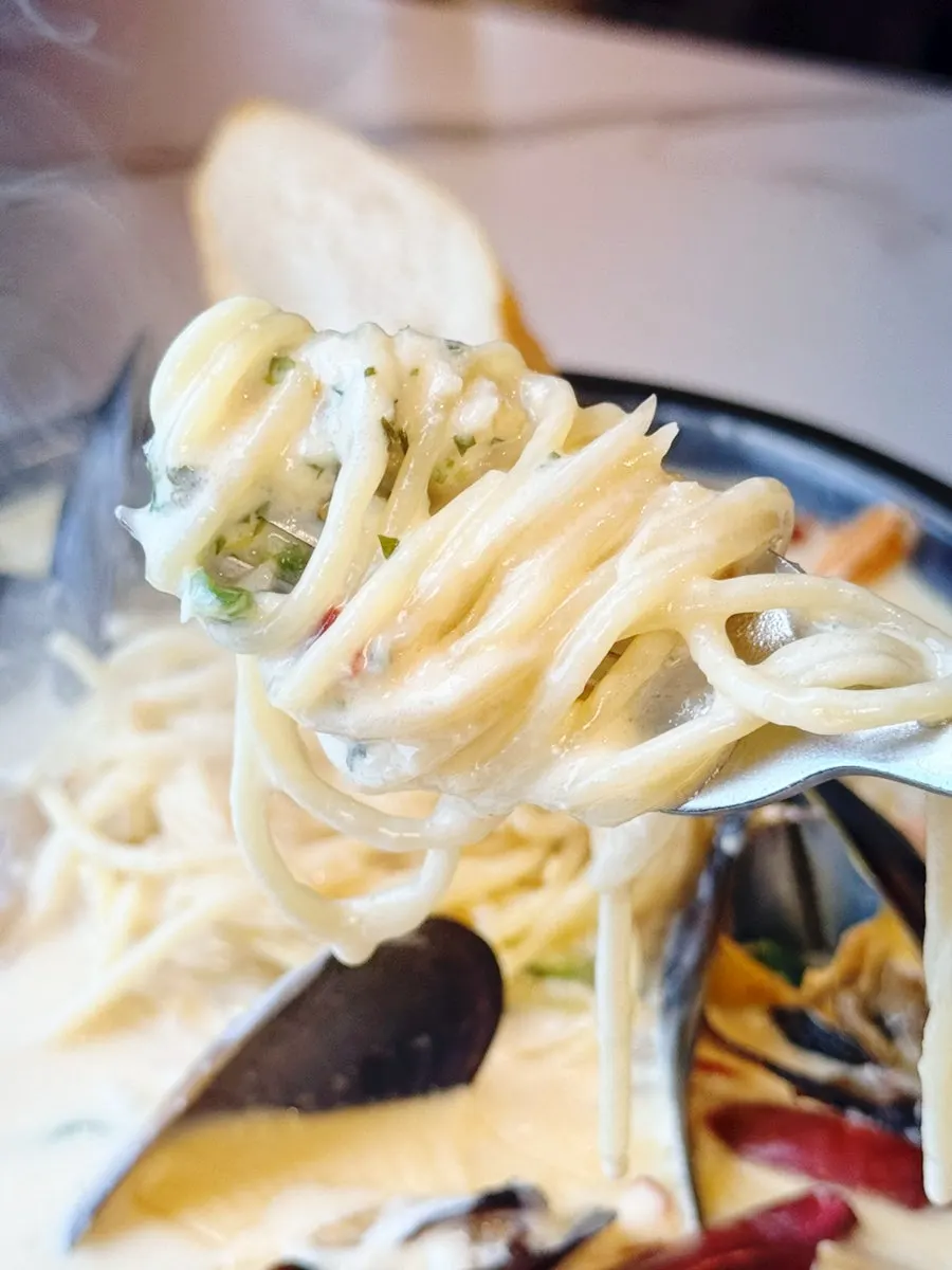 Pasta noodles coated in cream sauce